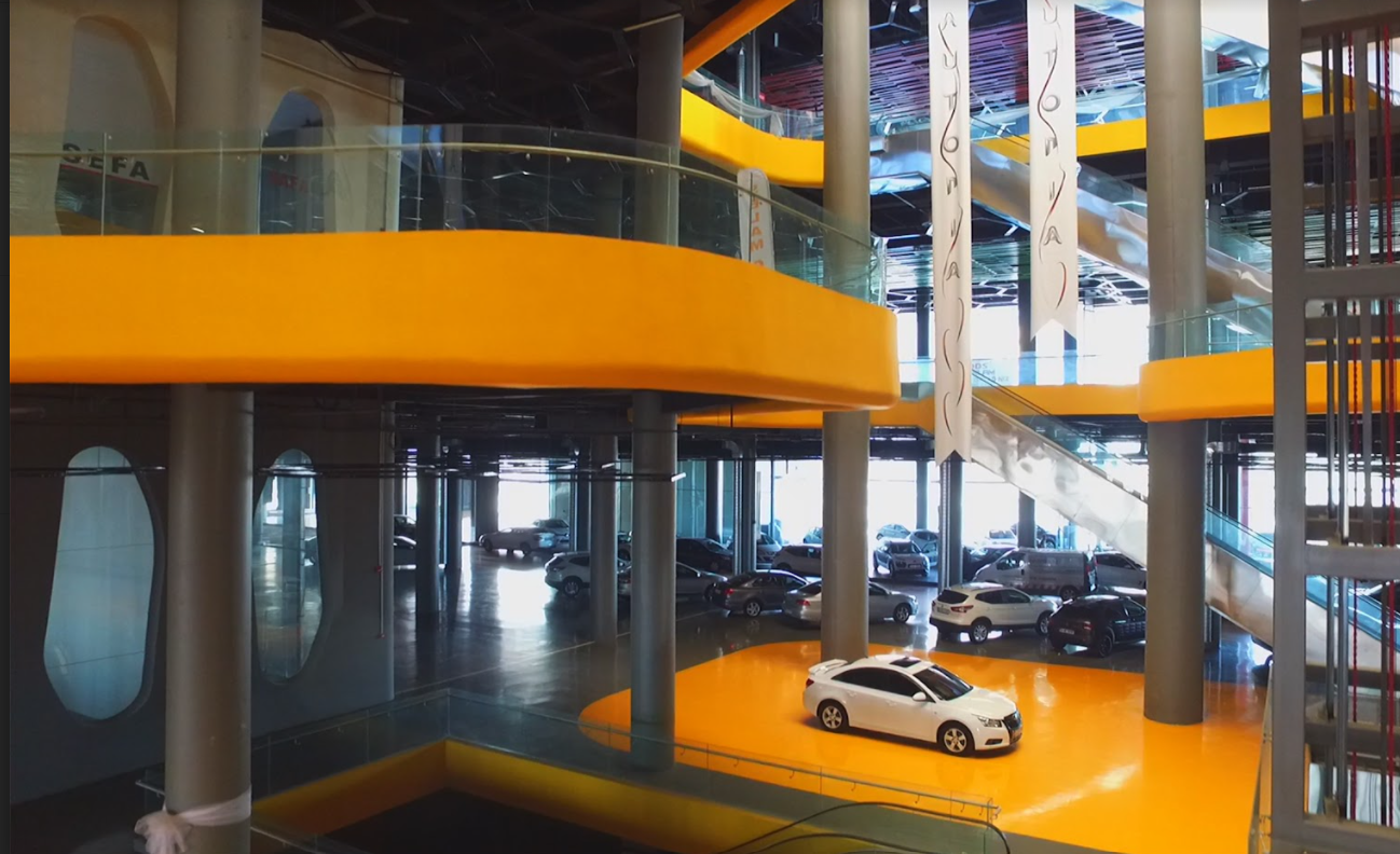 An automobile center with spaces for sale